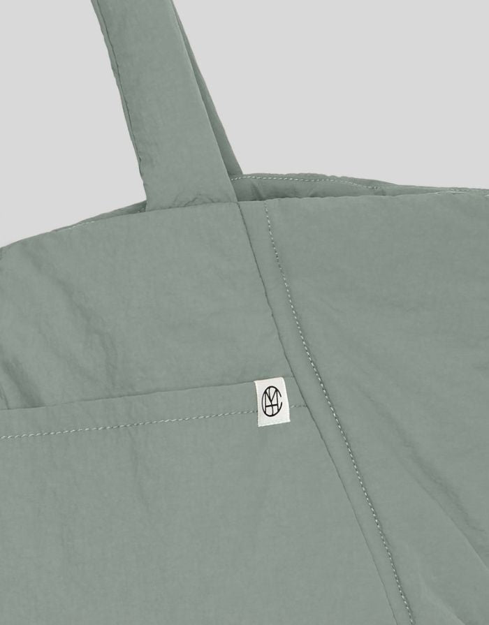 MSCH Copenhagen Tasche Siria Sasja Icon Laurel Wreath in Grün als gesteppter Shopper mit gepolsterten Griffen.