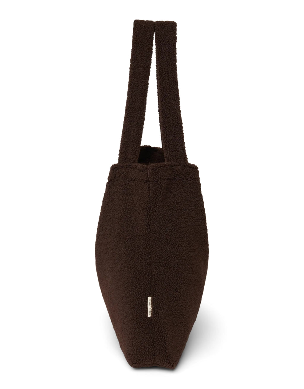 Schokoladenbraune Mom Bag Chocolate Teddy von Studio Noos aus weichem Teddy-Material mit langen Tragehenkeln.