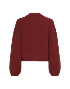 Unser Cardigan Zafina von MSCH Copenhagen in Syrah – grob gestrickter Cardigan mit breiter Knopfleiste, Ballonärmeln und boxy Schnitt.