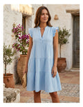  Kurzes hellblaues Musselin Kleid von Estée Brown mit Rüschenärmeln an den Schultern und lockerer Passform.