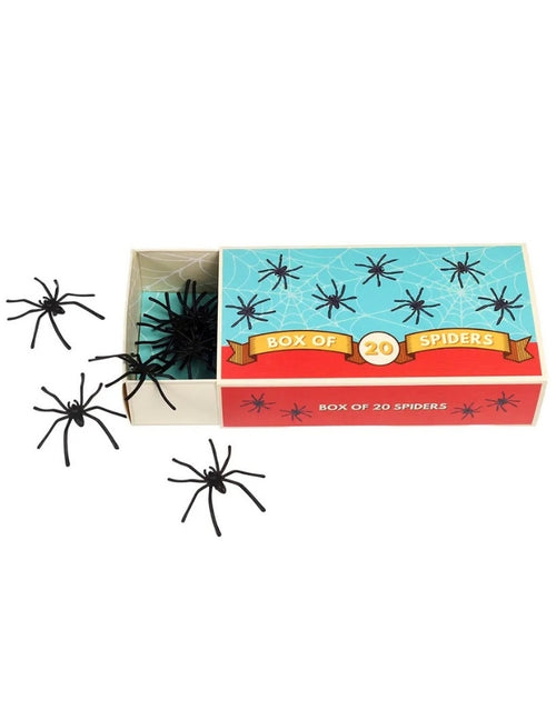 Set mit 20 schwarzen Deko-Spinnen von Rex London aus Kunststoff für Halloween-Partys und gruselige Dekorationen neben Verpackung