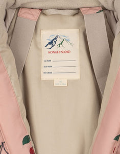 Rosa Schneeeinteiler mit Kirschmuster von Konges Sløjd, wasser- und winddicht, mit abnehmbarer Kapuze und Fleecefutter.