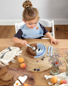 Hellblaue Kinderschale aus flexiblem Silikon mit Smiley-Motiv, BPA-frei, mikrowellen- und spülmaschinengeeignet, für Babys ab 6 Monaten.