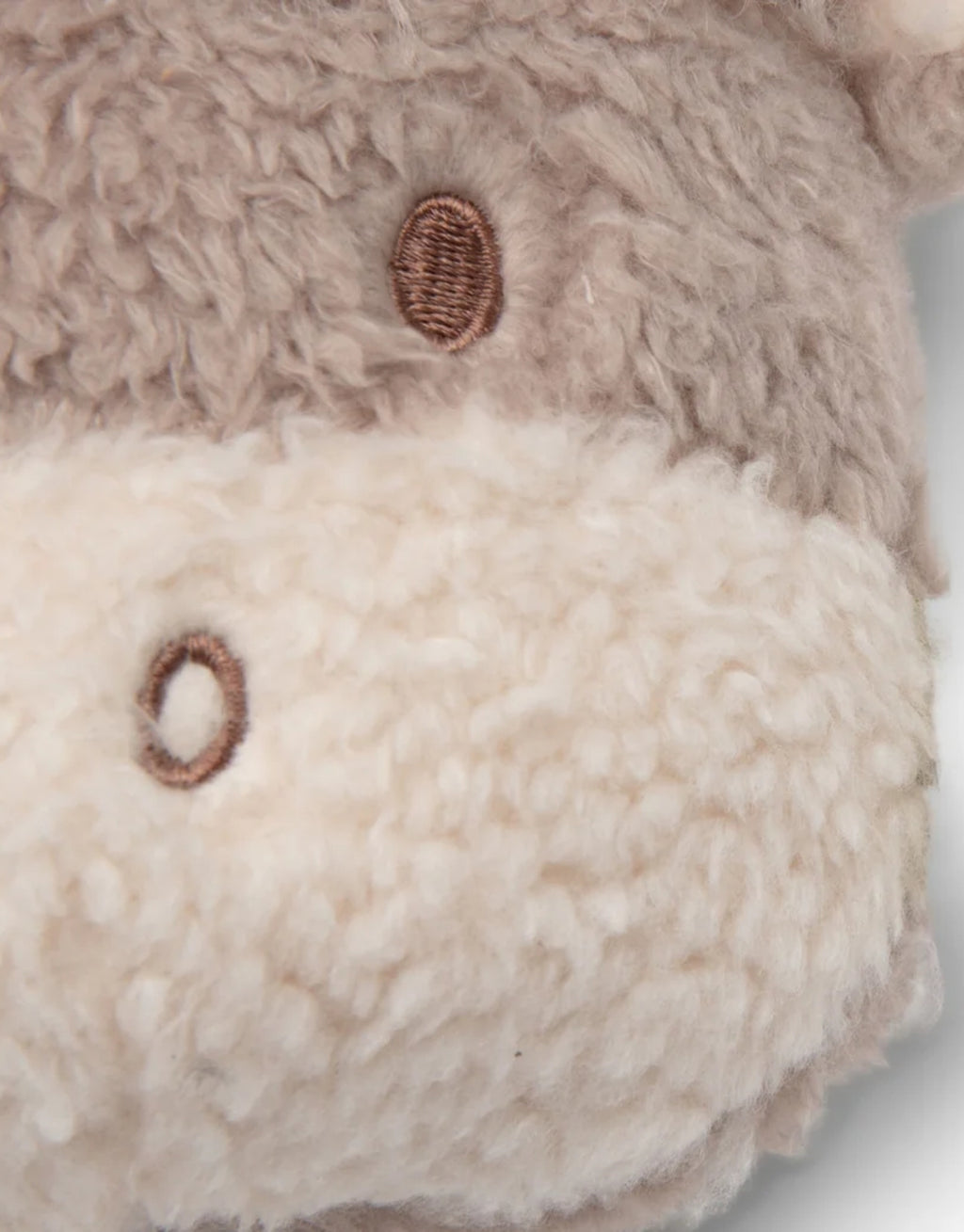 Weiche Spieluhr Highlander Chou von Jollein mit Holzring zum Aufziehen und beruhigender Brahms-Melodie für Babys.