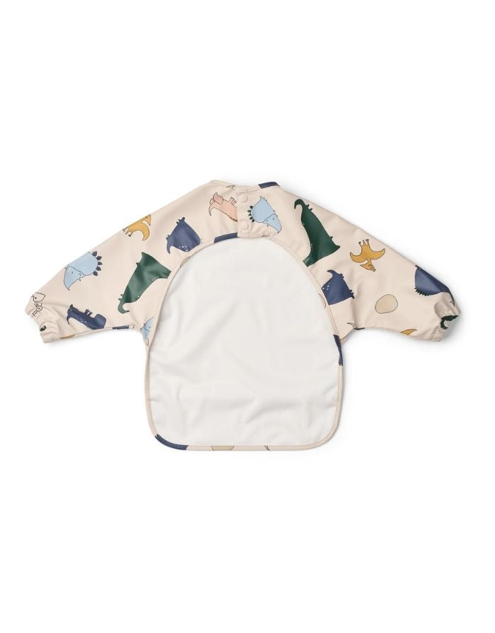 Liewood Ärmellätzchen Dino Roar/Sandy mit langen Ärmeln, Dino-Print, elastischen Bündchen und großer Auffangtasche von hinten.