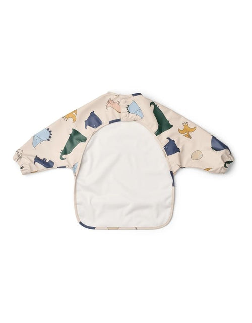 Liewood Ärmellätzchen Dino Roar/Sandy mit langen Ärmeln, Dino-Print, elastischen Bündchen und großer Auffangtasche von hinten.