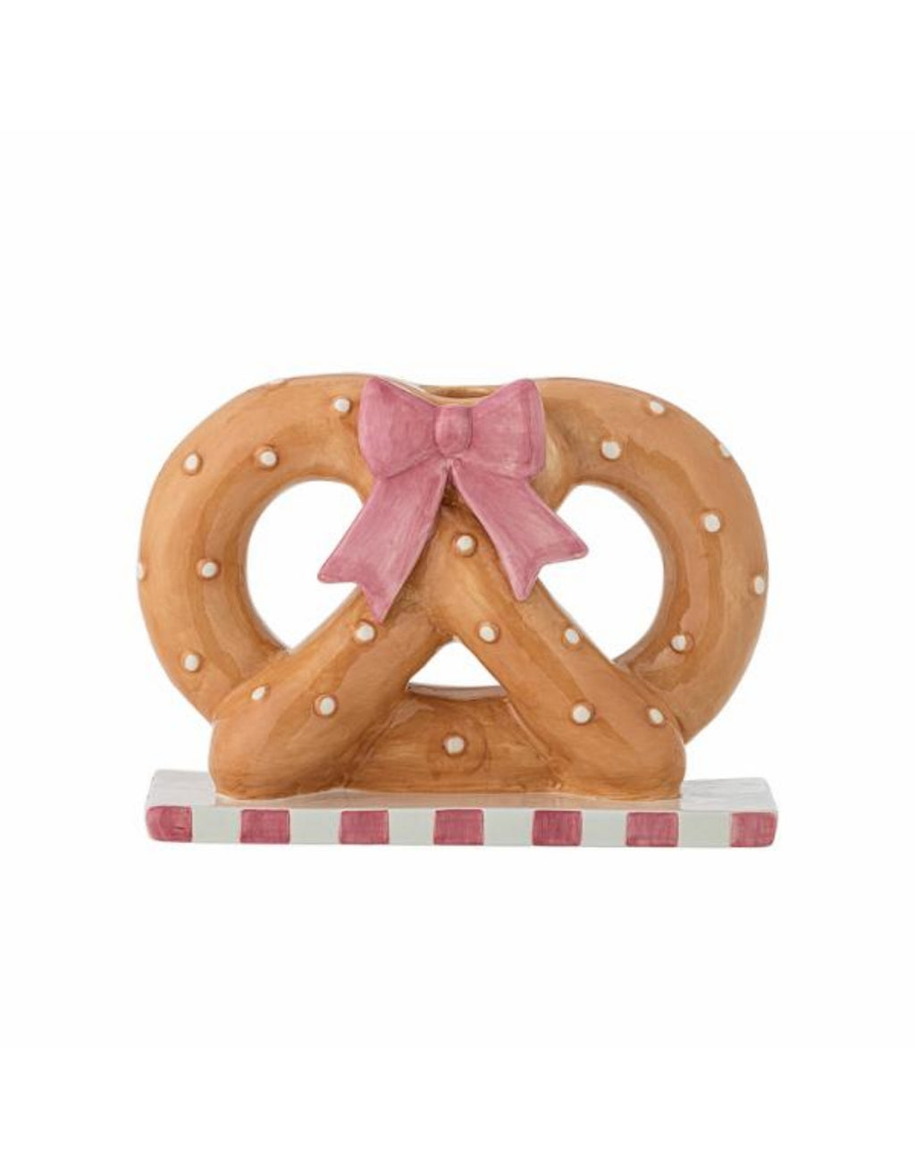 Brauner Pretzie Kerzenhalter von Bloomingville aus handbemalter Keramik in Brezelform mit weißen Punkten und rosa weiß gestreiftem Sockel.